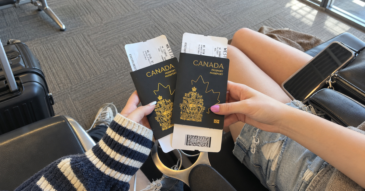 Supplied image of Canadian passports and boarding passes at an airport